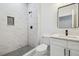 Modern bathroom with a glass-enclosed shower, white vanity, and stylish fixtures at 2216 W Lanier St, Lakeland, FL 33815