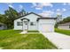 Beautiful home with a manicured lawn, modern design, and inviting curb appeal at 2216 W Lanier St, Lakeland, FL 33815
