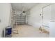 Clean, spacious garage with ample storage and an automatic door at 2216 W Lanier St, Lakeland, FL 33815