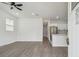 Spacious living room and kitchen featuring modern flooring, stainless steel appliances and recessed lighting at 2216 W Lanier St, Lakeland, FL 33815