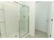 The bathroom features a clear glass enclosed shower at 4532 Ranunculus St, Lake Hamilton, FL 33851