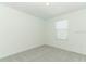 This is a bright bedroom featuring plush carpeting and a window with blinds at 4532 Ranunculus St, Lake Hamilton, FL 33851