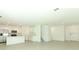 Open-concept living area with a kitchen, a large living room, and a dining area at 4532 Ranunculus St, Lake Hamilton, FL 33851