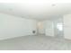 Large, open living room with plush gray carpeting at 4532 Ranunculus St, Lake Hamilton, FL 33851