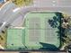 Aerial view of tennis and basketball courts within the residential community, surrounded by greenery at 8825 Latrec Ave # 6308, Orlando, FL 32819
