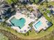 Aerial showcasing pools, lounge areas, and well-manicured landscaping at the community amenity center at 8825 Latrec Ave # 6308, Orlando, FL 32819
