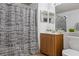 Well-maintained bathroom with a vanity, mirror, and shower, offering essential amenities for daily routines at 8825 Latrec Ave # 6308, Orlando, FL 32819