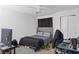 Neat bedroom with a cozy bed, clean walls, and storage, offering a comfortable and practical living space at 8825 Latrec Ave # 6308, Orlando, FL 32819