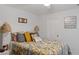 Cozy bedroom with decorative lamps, a comfortable bed, and plenty of natural light, creating a tranquil retreat at 8825 Latrec Ave # 6308, Orlando, FL 32819