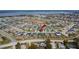 An aerial view of the home in a residential neighborhood, with lake view at 139 Sunfish Dr, Winter Haven, FL 33881