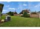 Large backyard with privacy wall, lush lawn and a mature landscaping at 139 Sunfish Dr, Winter Haven, FL 33881
