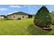 Large backyard with lush green lawn and mature landscaping at 139 Sunfish Dr, Winter Haven, FL 33881