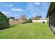 Large backyard with privacy wall and lush grass at 139 Sunfish Dr, Winter Haven, FL 33881