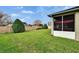 Green backyard with privacy wall and screened patio at 139 Sunfish Dr, Winter Haven, FL 33881