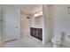 A bright bathroom featuring a double vanity, tub and shower combo, toilet, and tile floor at 139 Sunfish Dr, Winter Haven, FL 33881