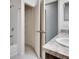 Bathroom showing a single sink, a tub and shower, and a view into the walk-in closet at 139 Sunfish Dr, Winter Haven, FL 33881