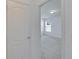 View through doorway into a bright bedroom with neutral walls and carpet and natural light at 139 Sunfish Dr, Winter Haven, FL 33881