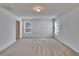 Bedroom featuring carpet, neutral walls and two windows providing natural light at 139 Sunfish Dr, Winter Haven, FL 33881