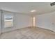 Large, airy bedroom with carpet, natural light and adjacent doorway to walk in closet at 139 Sunfish Dr, Winter Haven, FL 33881