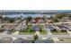 A straight-on aerial view of the home, showing its lawn, landscaping, driveway, and roof at 139 Sunfish Dr, Winter Haven, FL 33881