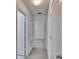 Hallway with white doors, neutral carpet and white walls at 139 Sunfish Dr, Winter Haven, FL 33881