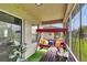 Enclosed patio featuring comfortable furniture, a small table, and an outdoor view at 139 Sunfish Dr, Winter Haven, FL 33881