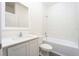 Bathroom featuring a bath/shower combo, tiled surround, and white vanity at 13434 Leaping Water Way, Astatula, FL 34705