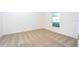 Clean bedroom with neutral carpeting and natural light from a window at 13434 Leaping Water Way, Astatula, FL 34705