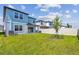 Backyard featuring lush green grass and privacy fence at 276 Woodsage Pl, Lake Alfred, FL 33850