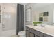 Bathroom featuring a shower-tub combo, modern vanity, and stylish decor at 276 Woodsage Pl, Lake Alfred, FL 33850