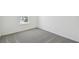 Bedroom showcasing neutral carpet, white walls and baseboards at 276 Woodsage Pl, Lake Alfred, FL 33850