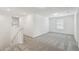 Bright loft space with neutral walls, plush carpeting, and a large window, ready for personalization at 276 Woodsage Pl, Lake Alfred, FL 33850