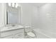 Modern bathroom with a sleek vanity, undermount sink, and subway tile shower at 284 Woodsage Pl, Lake Alfred, FL 33850