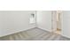 Bright, vacant bedroom features a neutral color scheme and soft carpeting at 284 Woodsage Pl, Lake Alfred, FL 33850