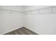 Empty closet featuring wire shelving in a neutral color scheme at 284 Woodsage Pl, Lake Alfred, FL 33850