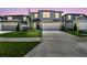 Two-story home with manicured lawn, well-lit garage, and a contemporary design at 284 Woodsage Pl, Lake Alfred, FL 33850