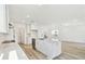 Bright kitchen features a center island with a sink, light countertops, and open access to the living area at 284 Woodsage Pl, Lake Alfred, FL 33850