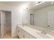 Modern bathroom with double vanity sinks, white countertops, and ample lighting at 5025 Bougainvillea Ct, Lake Hamilton, FL 33851