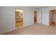 Bright bedroom with carpeted floor, bathroom, and a walk-in closet at 5025 Bougainvillea Ct, Lake Hamilton, FL 33851