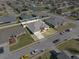 Aerial view of a single-Gathering home with a well-maintained lawn and a fenced backyard at 524 Buckshot Ln, Lakeland, FL 33809