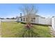 Fenced backyard featuring a well-maintained lawn, offering privacy and space at 524 Buckshot Ln, Lakeland, FL 33809