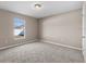 Carpeted bedroom featuring a window overlooking the neighborhood at 524 Buckshot Ln, Lakeland, FL 33809