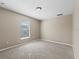 Bedroom with neutral carpet and a window with blinds at 524 Buckshot Ln, Lakeland, FL 33809