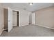 Neutral bedroom featuring plush carpet, and a closet for ample storage at 524 Buckshot Ln, Lakeland, FL 33809