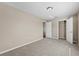 Bedroom with doors, closet, and neutral carpet at 524 Buckshot Ln, Lakeland, FL 33809