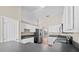 Bright kitchen featuring white cabinets, stainless steel appliances, and contrasting countertops at 524 Buckshot Ln, Lakeland, FL 33809