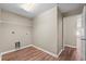 Bright laundry room with wooden floors and hookups for a washer and dryer at 524 Buckshot Ln, Lakeland, FL 33809