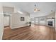 Cozy living room with wood-look floors, a decorative fireplace, and abundant natural light at 524 Buckshot Ln, Lakeland, FL 33809