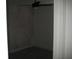 View of a dark, unfinished bedroom featuring a fan and light fixture at 1371 Pompay Dr, Davenport, FL 33896