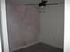 View of a dark, unfinished bedroom featuring a fan and light fixture at 1371 Pompay Dr, Davenport, FL 33896